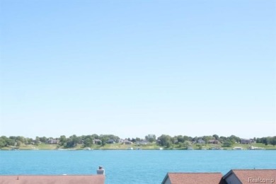 This stunning and spacious end unit condominium with premium on St Clair River Country Club in Michigan - for sale on GolfHomes.com, golf home, golf lot