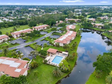 Beautifully updated 1,426 sqft two-story townhouse in the on Boca Lago Golf and Country Club in Florida - for sale on GolfHomes.com, golf home, golf lot