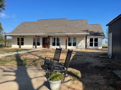 This beautiful move in ready lake house is open and airy and SOLD on Lake Bruin Golf and Country Club in Louisiana - for sale on GolfHomes.com, golf home, golf lot