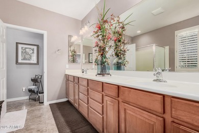 Immaculate single-level home with a bright, open floor plan on The Golf Club At Johnson Ranch in Arizona - for sale on GolfHomes.com, golf home, golf lot