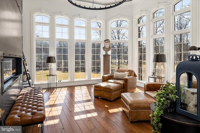 Set behind a private automated gate on nearly 3 acres, this on Golf Club At South River in Maryland - for sale on GolfHomes.com, golf home, golf lot