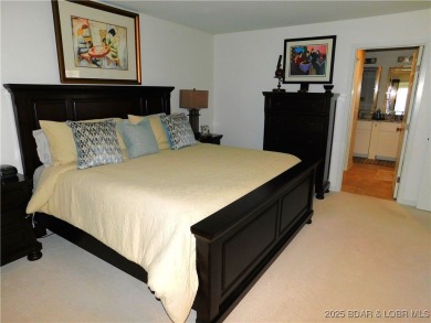 This ground-floor, 1-story, end unit enjoys easy access from the on Seasons Ridge At Four Seasons in Missouri - for sale on GolfHomes.com, golf home, golf lot