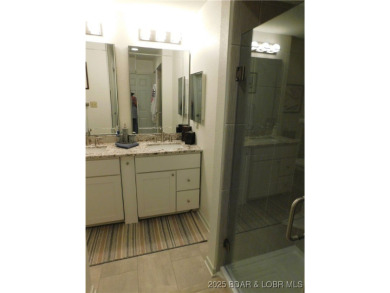 This ground-floor, 1-story, end unit enjoys easy access from the on Seasons Ridge At Four Seasons in Missouri - for sale on GolfHomes.com, golf home, golf lot