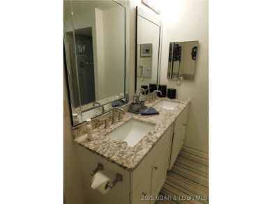 This ground-floor, 1-story, end unit enjoys easy access from the on Seasons Ridge At Four Seasons in Missouri - for sale on GolfHomes.com, golf home, golf lot