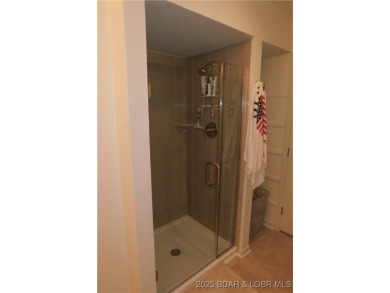This ground-floor, 1-story, end unit enjoys easy access from the on Seasons Ridge At Four Seasons in Missouri - for sale on GolfHomes.com, golf home, golf lot