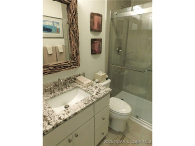 This ground-floor, 1-story, end unit enjoys easy access from the on Seasons Ridge At Four Seasons in Missouri - for sale on GolfHomes.com, golf home, golf lot