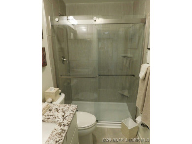 This ground-floor, 1-story, end unit enjoys easy access from the on Seasons Ridge At Four Seasons in Missouri - for sale on GolfHomes.com, golf home, golf lot