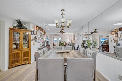 This end unit villa is right next to the covered carport and on Highland Lakes Executive Golf Course in Florida - for sale on GolfHomes.com, golf home, golf lot