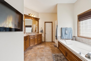 This beautifully updated Reflection Ridge ranch offers an ideal on Reflection Ridge Golf Club in Kansas - for sale on GolfHomes.com, golf home, golf lot