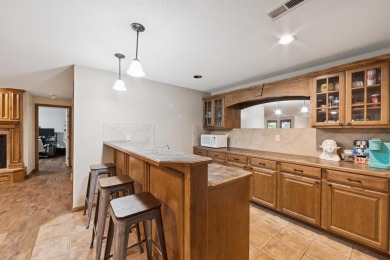 This beautifully updated Reflection Ridge ranch offers an ideal on Reflection Ridge Golf Club in Kansas - for sale on GolfHomes.com, golf home, golf lot