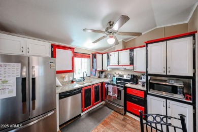 This charming 2-bedroom, 2-bath home is located in the highly on Paradise Peak Golf Course in Arizona - for sale on GolfHomes.com, golf home, golf lot