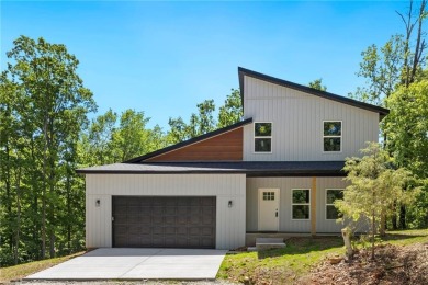 Be the first to own this beautifully designed modern home on the on  in Arkansas - for sale on GolfHomes.com, golf home, golf lot