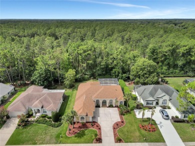 Discover luxurious living at 5348 Legend Hills Ln, nestled in on Silverthorn Country Club in Florida - for sale on GolfHomes.com, golf home, golf lot