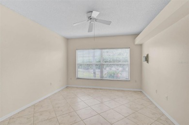 Ground Floor End-Unit Condo in Fairway Trace at Peridia Golf & on Peridia Golf and Country Club in Florida - for sale on GolfHomes.com, golf home, golf lot