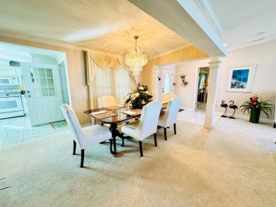 This 2001 Palm Harbor - St Andrews model home is situated on on Crane Lakes Golf and Country Club in Florida - for sale on GolfHomes.com, golf home, golf lot