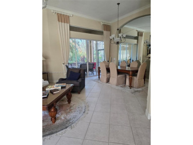 Enter through a private entrance to a peacefully courtyard with on Kensington Golf and Country Club in Florida - for sale on GolfHomes.com, golf home, golf lot