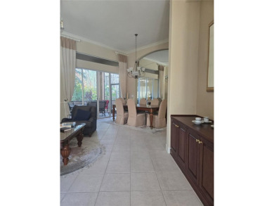 Enter through a private entrance to a peacefully courtyard with on Kensington Golf and Country Club in Florida - for sale on GolfHomes.com, golf home, golf lot
