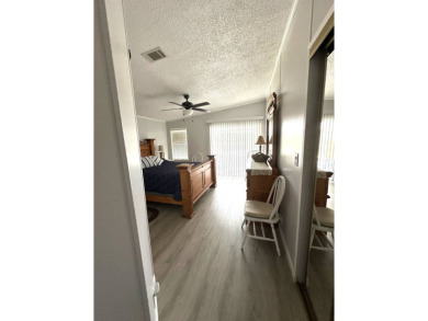 Escape to serenity in this charming 2-bedroom home, boasting on Schalamar Creek Golf and Country Club in Florida - for sale on GolfHomes.com, golf home, golf lot