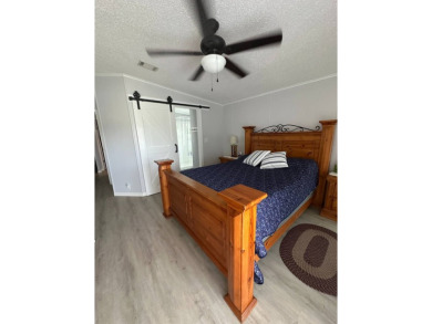 Escape to serenity in this charming 2-bedroom home, boasting on Schalamar Creek Golf and Country Club in Florida - for sale on GolfHomes.com, golf home, golf lot