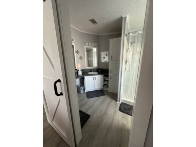Escape to serenity in this charming 2-bedroom home, boasting on Schalamar Creek Golf and Country Club in Florida - for sale on GolfHomes.com, golf home, golf lot