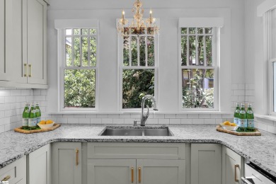 This fully renovated 4 bedroom, 2  1/2  bathroom bungalow blends on Greenville Country Club in South Carolina - for sale on GolfHomes.com, golf home, golf lot