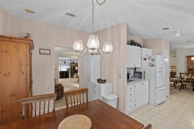 Nestled against a tranquil wooded backdrop, this beautifully on El Diablo Executive Golf Course in Florida - for sale on GolfHomes.com, golf home, golf lot