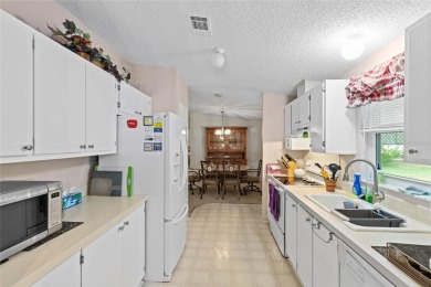 Nestled against a tranquil wooded backdrop, this beautifully on El Diablo Executive Golf Course in Florida - for sale on GolfHomes.com, golf home, golf lot