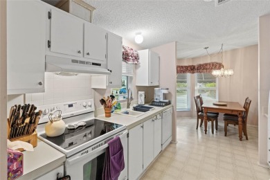 Nestled against a tranquil wooded backdrop, this beautifully on El Diablo Executive Golf Course in Florida - for sale on GolfHomes.com, golf home, golf lot