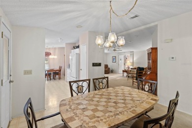 Nestled against a tranquil wooded backdrop, this beautifully on El Diablo Executive Golf Course in Florida - for sale on GolfHomes.com, golf home, golf lot