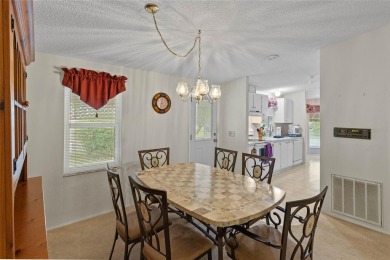 Nestled against a tranquil wooded backdrop, this beautifully on El Diablo Executive Golf Course in Florida - for sale on GolfHomes.com, golf home, golf lot