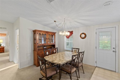 Nestled against a tranquil wooded backdrop, this beautifully on El Diablo Executive Golf Course in Florida - for sale on GolfHomes.com, golf home, golf lot