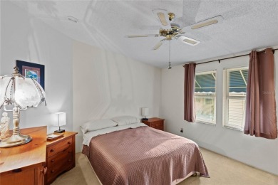 Nestled against a tranquil wooded backdrop, this beautifully on El Diablo Executive Golf Course in Florida - for sale on GolfHomes.com, golf home, golf lot