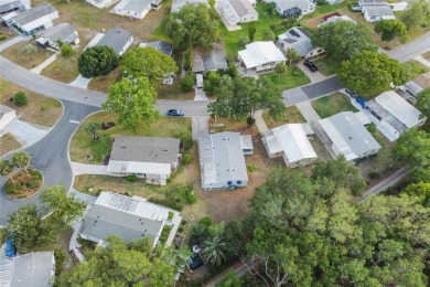 Nestled against a tranquil wooded backdrop, this beautifully on El Diablo Executive Golf Course in Florida - for sale on GolfHomes.com, golf home, golf lot