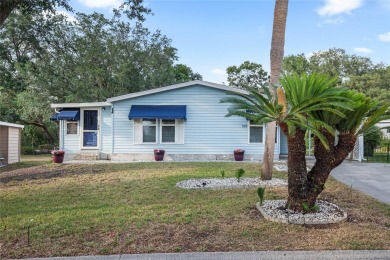 Nestled against a tranquil wooded backdrop, this beautifully on El Diablo Executive Golf Course in Florida - for sale on GolfHomes.com, golf home, golf lot
