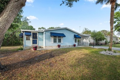 Nestled against a tranquil wooded backdrop, this beautifully on El Diablo Executive Golf Course in Florida - for sale on GolfHomes.com, golf home, golf lot
