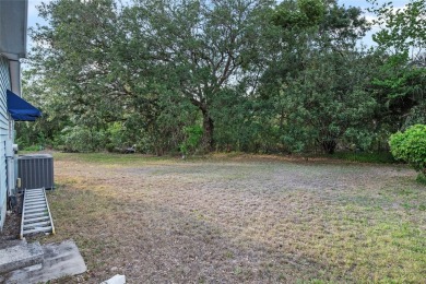 Nestled against a tranquil wooded backdrop, this beautifully on El Diablo Executive Golf Course in Florida - for sale on GolfHomes.com, golf home, golf lot