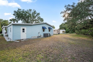Nestled against a tranquil wooded backdrop, this beautifully on El Diablo Executive Golf Course in Florida - for sale on GolfHomes.com, golf home, golf lot