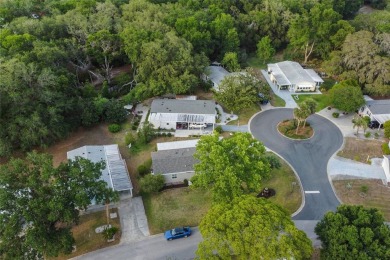 Nestled against a tranquil wooded backdrop, this beautifully on El Diablo Executive Golf Course in Florida - for sale on GolfHomes.com, golf home, golf lot