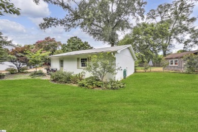 This fully renovated 4 bedroom, 2  1/2  bathroom bungalow blends on Greenville Country Club in South Carolina - for sale on GolfHomes.com, golf home, golf lot