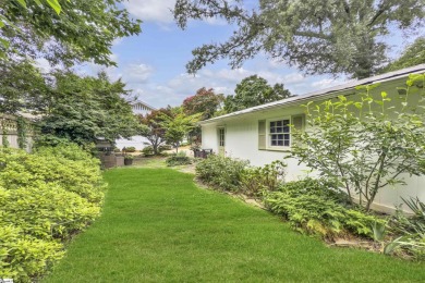 This fully renovated 4 bedroom, 2  1/2  bathroom bungalow blends on Greenville Country Club in South Carolina - for sale on GolfHomes.com, golf home, golf lot