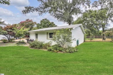 This fully renovated 4 bedroom, 2  1/2  bathroom bungalow blends on Greenville Country Club in South Carolina - for sale on GolfHomes.com, golf home, golf lot