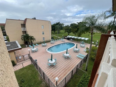 This 2 bed/2 bath top floor home has tons of potential!  With on Sunrise Lakes Phase III in Florida - for sale on GolfHomes.com, golf home, golf lot