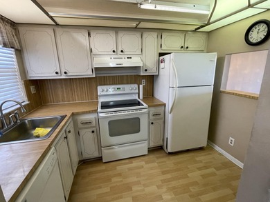 This 2 bed/2 bath top floor home has tons of potential!  With on Sunrise Lakes Phase III in Florida - for sale on GolfHomes.com, golf home, golf lot