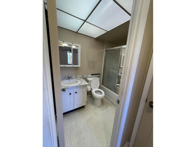 This 2 bed/2 bath top floor home has tons of potential!  With on Sunrise Lakes Phase III in Florida - for sale on GolfHomes.com, golf home, golf lot