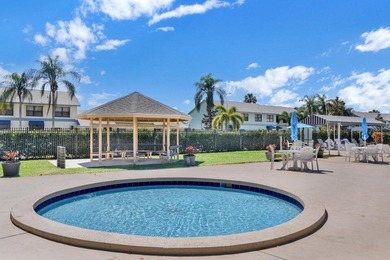 This corner 3rd-floor residence in Whitehall Condominium on  in Florida - for sale on GolfHomes.com, golf home, golf lot