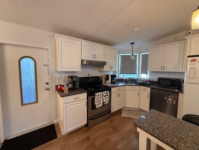 This updated, clean home is coming mostly furnished and is ready on Whisperwood Golf Course in Florida - for sale on GolfHomes.com, golf home, golf lot