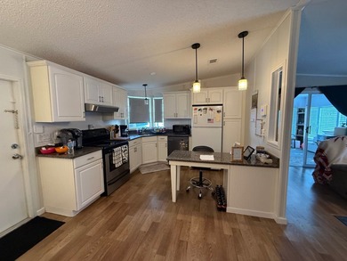 This updated, clean home is coming mostly furnished and is ready on Whisperwood Golf Course in Florida - for sale on GolfHomes.com, golf home, golf lot