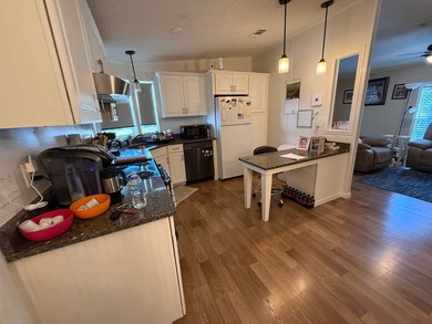 This updated, clean home is coming mostly furnished and is ready on Whisperwood Golf Course in Florida - for sale on GolfHomes.com, golf home, golf lot