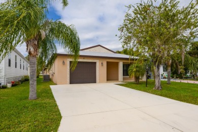 Very solid concrete block home with metal roof and accordion on Spanish Lakes I in Florida - for sale on GolfHomes.com, golf home, golf lot