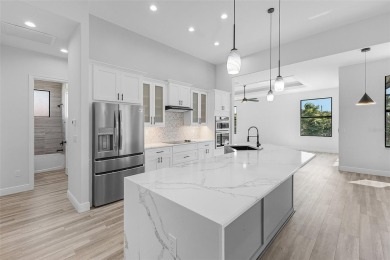 Discover this stunning new construction pool home in the on Burnt Store Golf Club in Florida - for sale on GolfHomes.com, golf home, golf lot